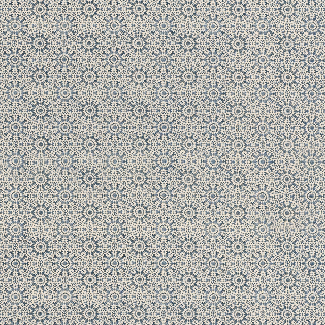 Small indigo rosettes and dotted motifs repeat over a cream ground