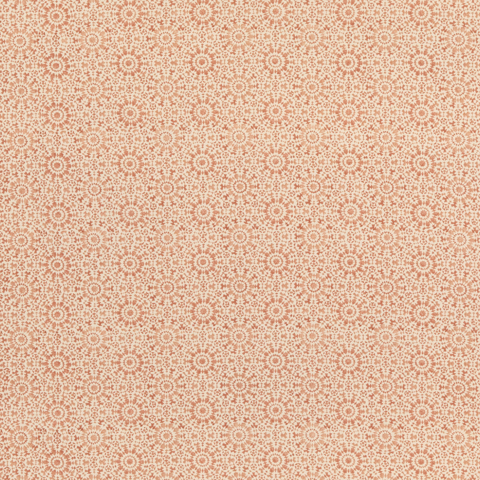 Warm terracotta and cream cotton-linen fabric with repeating tiny rosettes and geometric motifs