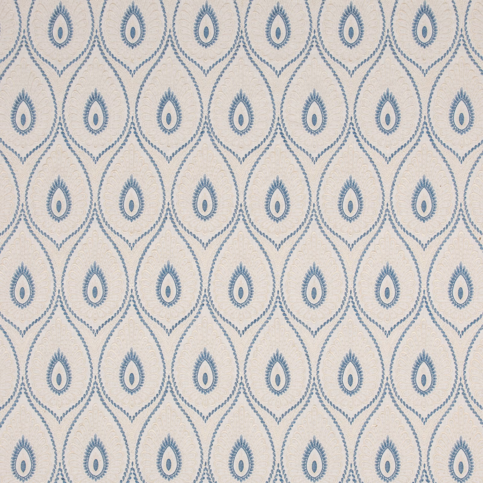 Muted blue teardrop medallions repeat across a softly textured ivory ground