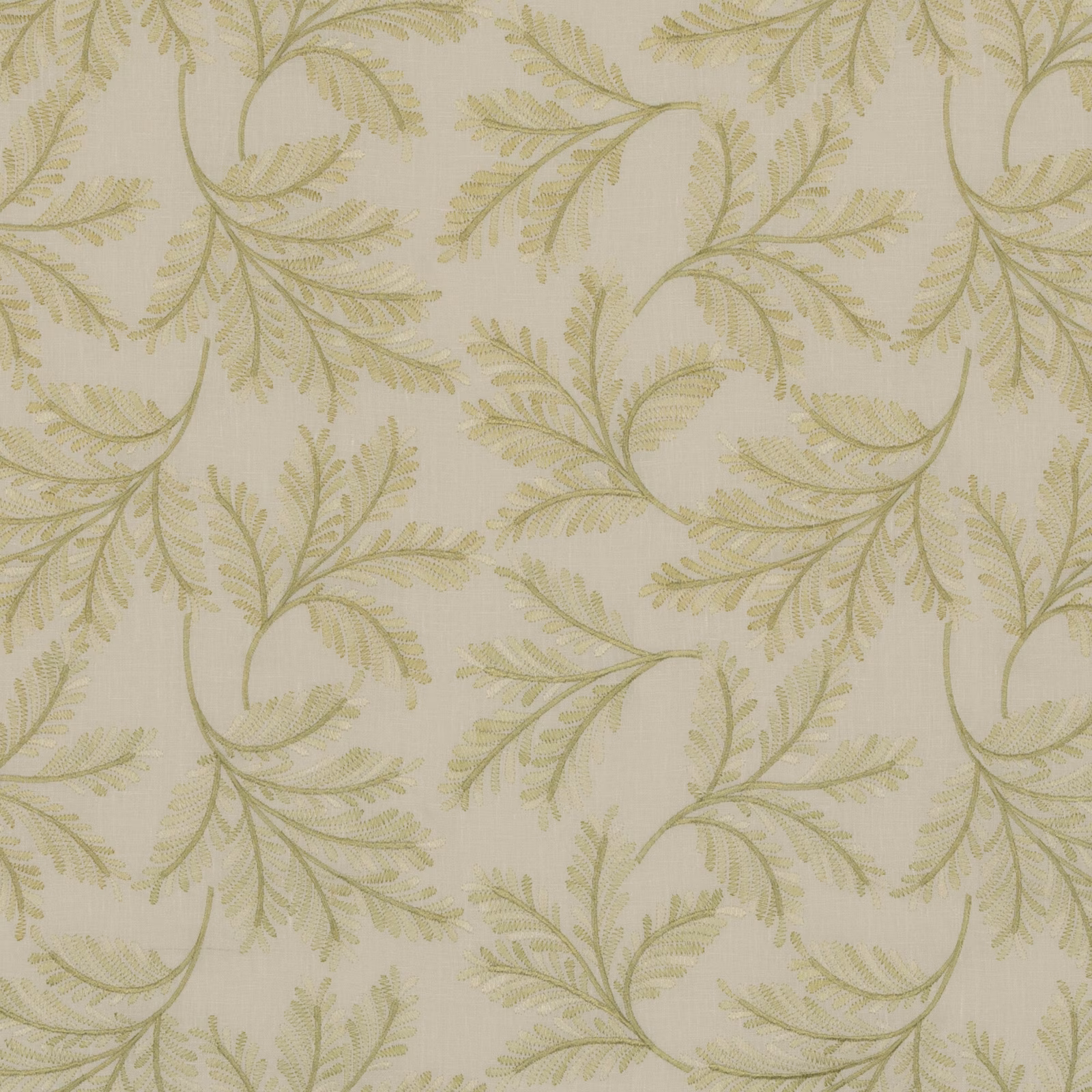 Pale spring-green fabric with curling fern branches on a creamy woven ground