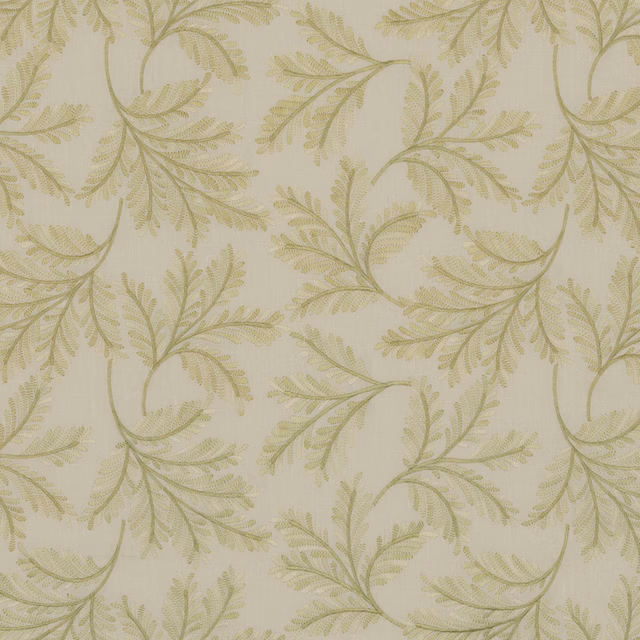 Pale spring-green fabric with curling fern branches on a creamy woven ground