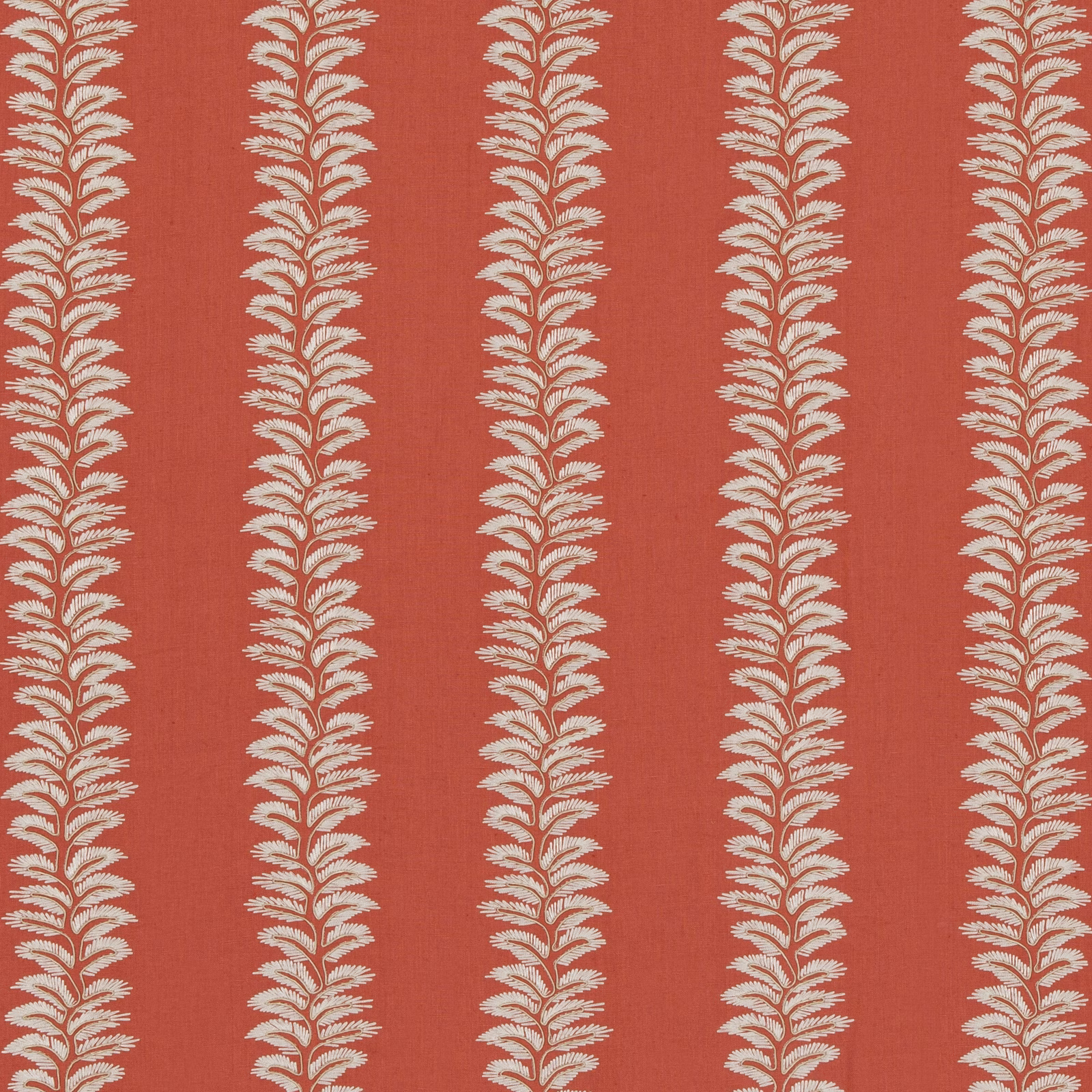 Warm coral fabric with repeating ivory leafy botanical columns and a fine woven texture