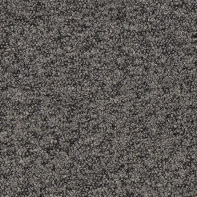 Close-up of dense charcoal grey boucle with mottled black and graphite loops