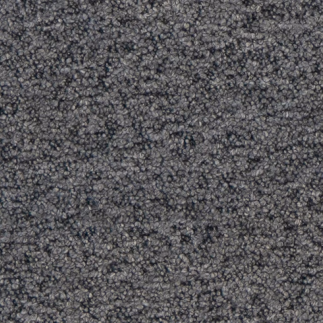 Close-up of deep indigo-blue bouclé with dense, irregular charcoal loops