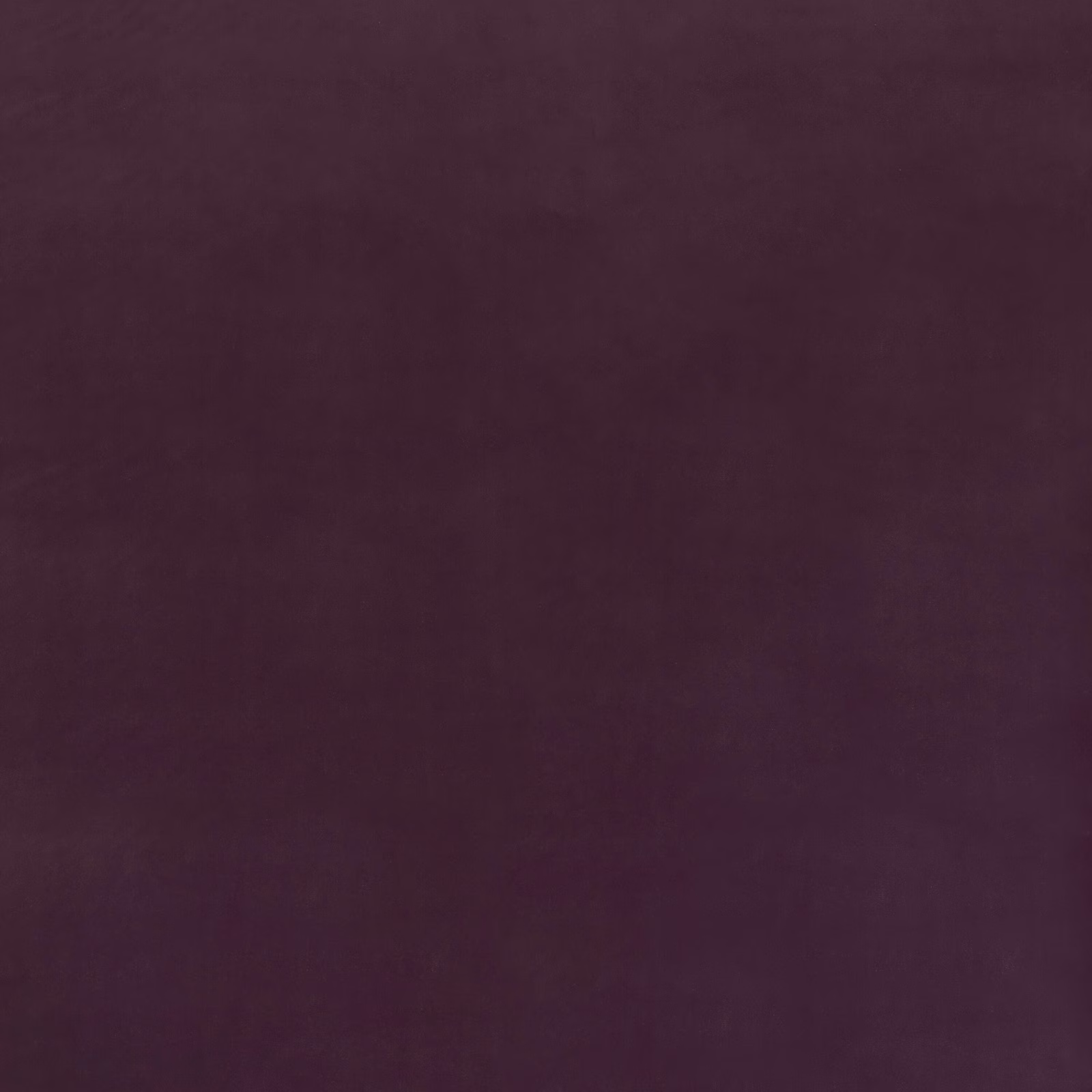 Plain deep aubergine velvet swatch showing subtle nap and tonal light variation