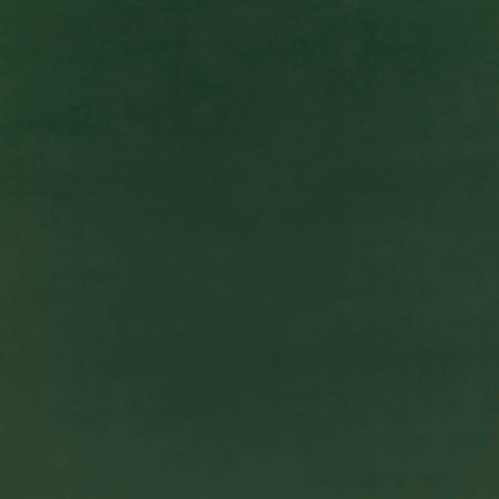 Deep forest green velvet with subtle nap shading and a soft low-sheen surface