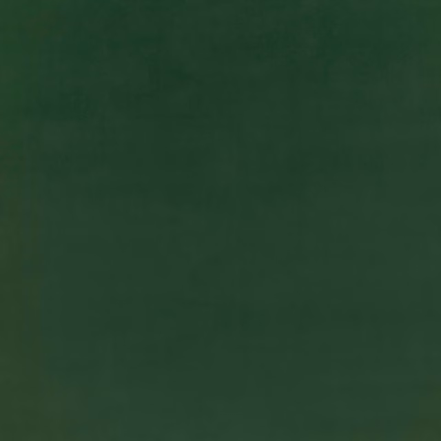 Deep forest green velvet with subtle nap shading and a soft low-sheen surface