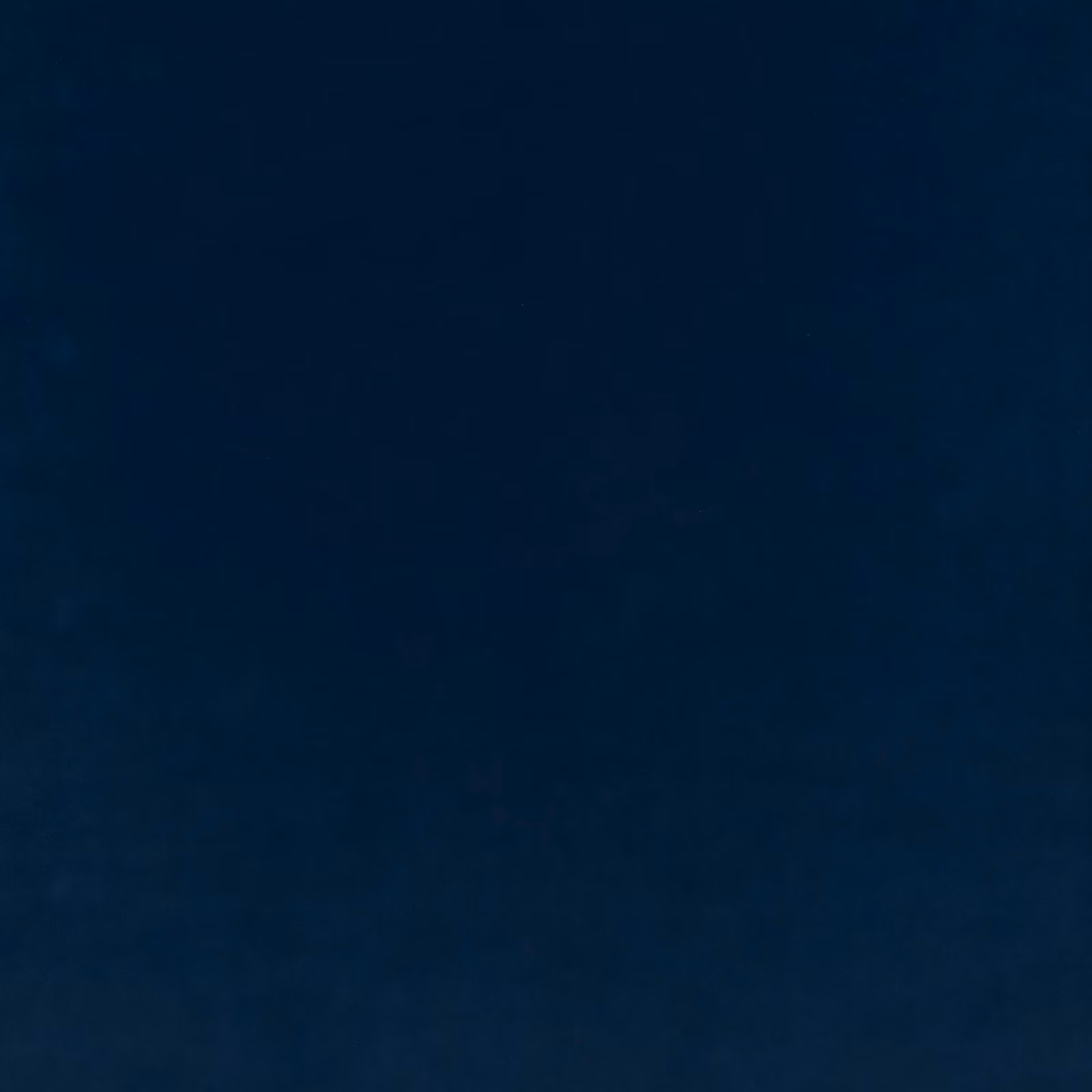 Deep midnight-blue plain velvet showing subtle nap shading across its plush surface