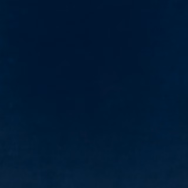 Deep midnight-blue plain velvet showing subtle nap shading across its plush surface