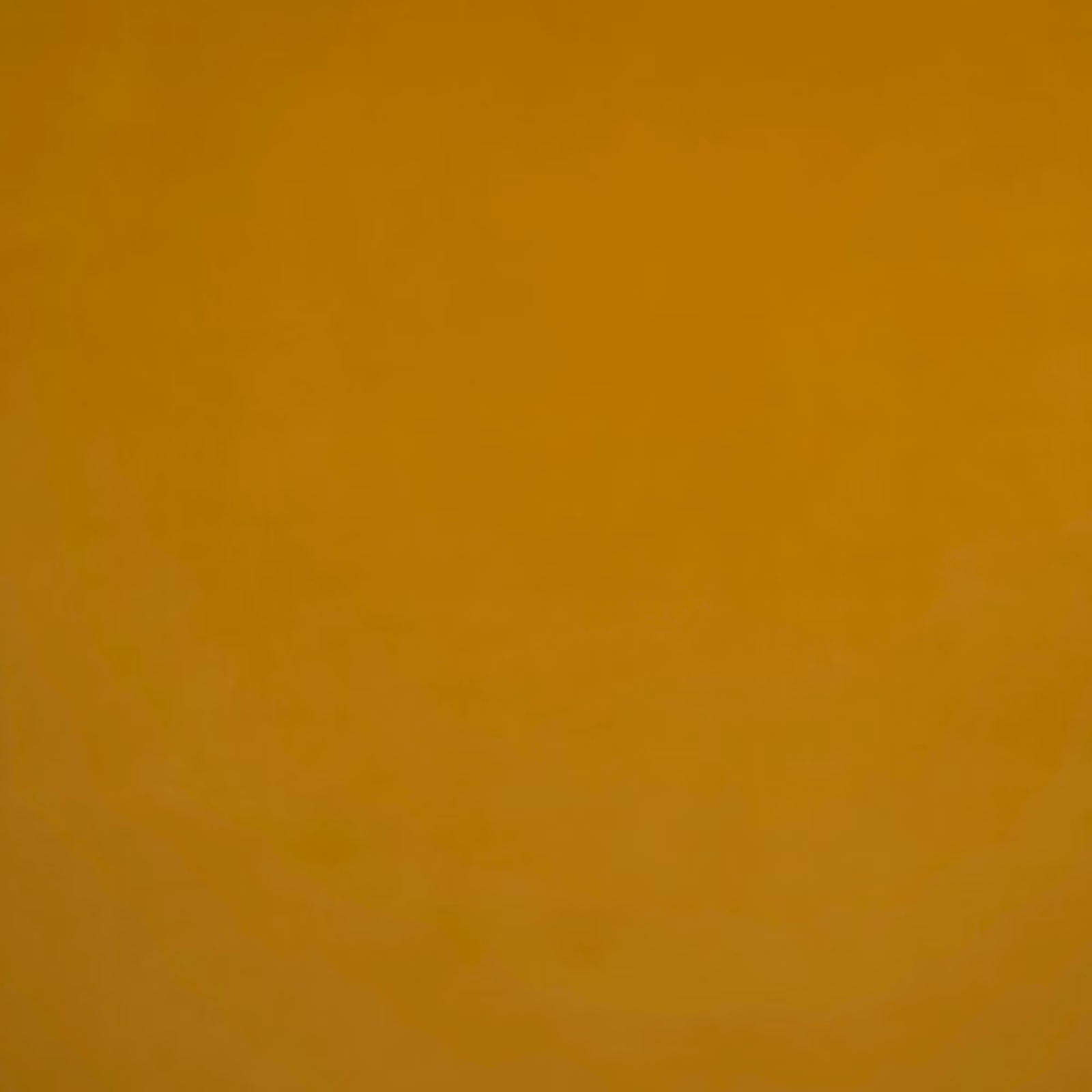 Warm ochre velvet with a smooth plush nap and subtle tonal shading