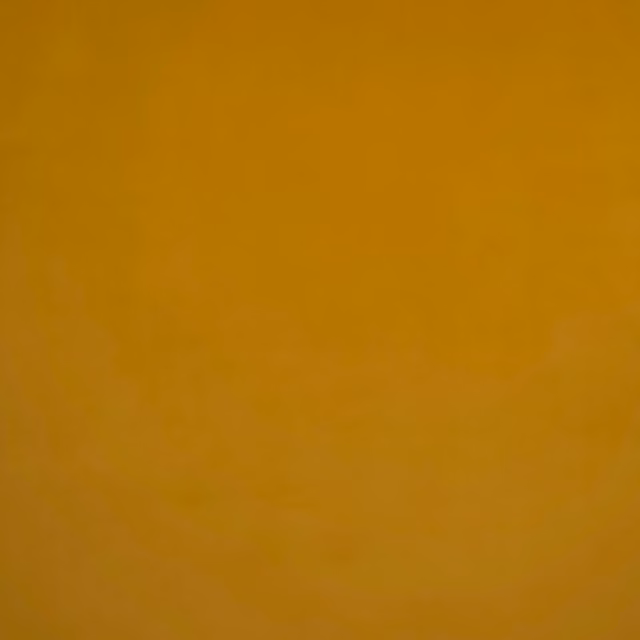 Warm ochre velvet with a smooth plush nap and subtle tonal shading