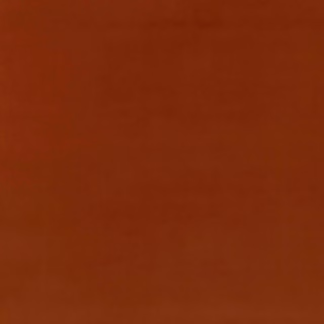 Deep spice terracotta velvet showing soft directional nap and subtle tonal shading