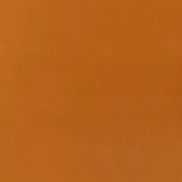 Warm camel-tan velvet with subtle nap shading across a plain surface