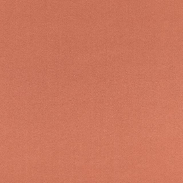 Muted dusky-rose plain linen weave with subtle coral-pink tonal texture
