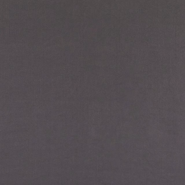 Deep graphite grey linen blend with a subtle, softly irregular plain weave