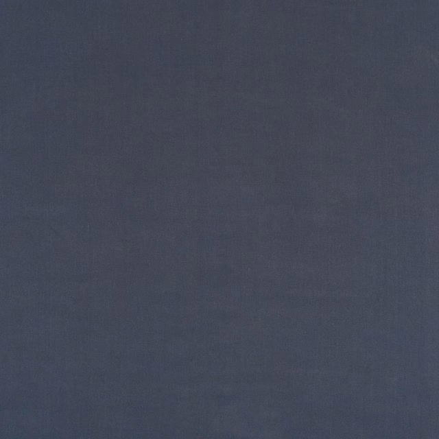 Deep indigo blue linen with a softly mottled, fine vertical weave.