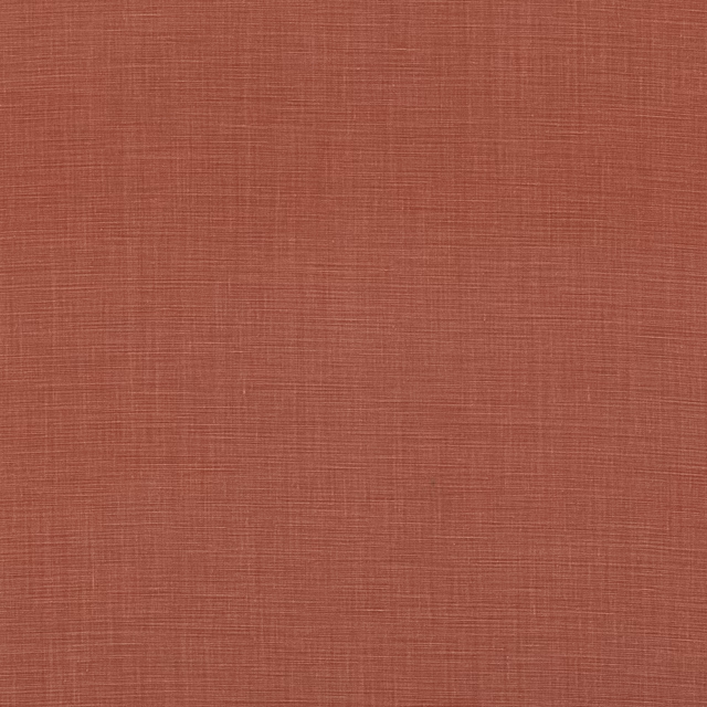 Muted terracotta linen with a fine crosshatched weave and softly varied red-clay tone