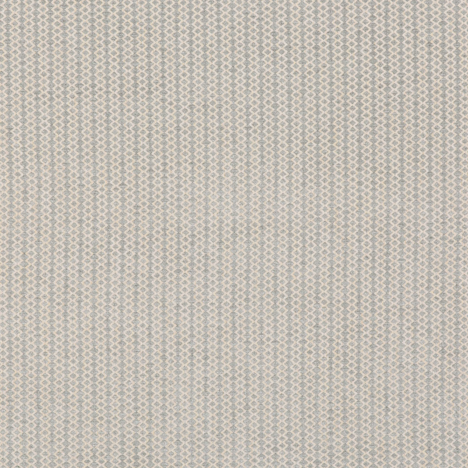 Close view of soft blue-grey woven fabric with tiny pale diamond motifs