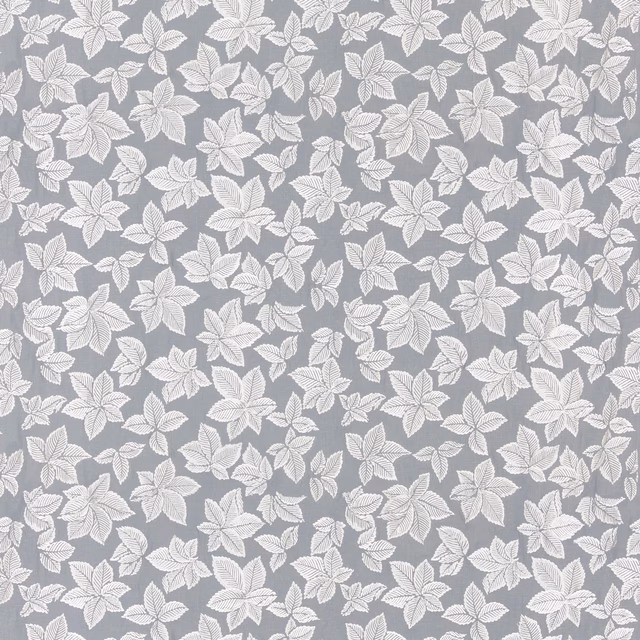 Muted denim-blue ground with ivory leaf sprays and fine linear vein detail