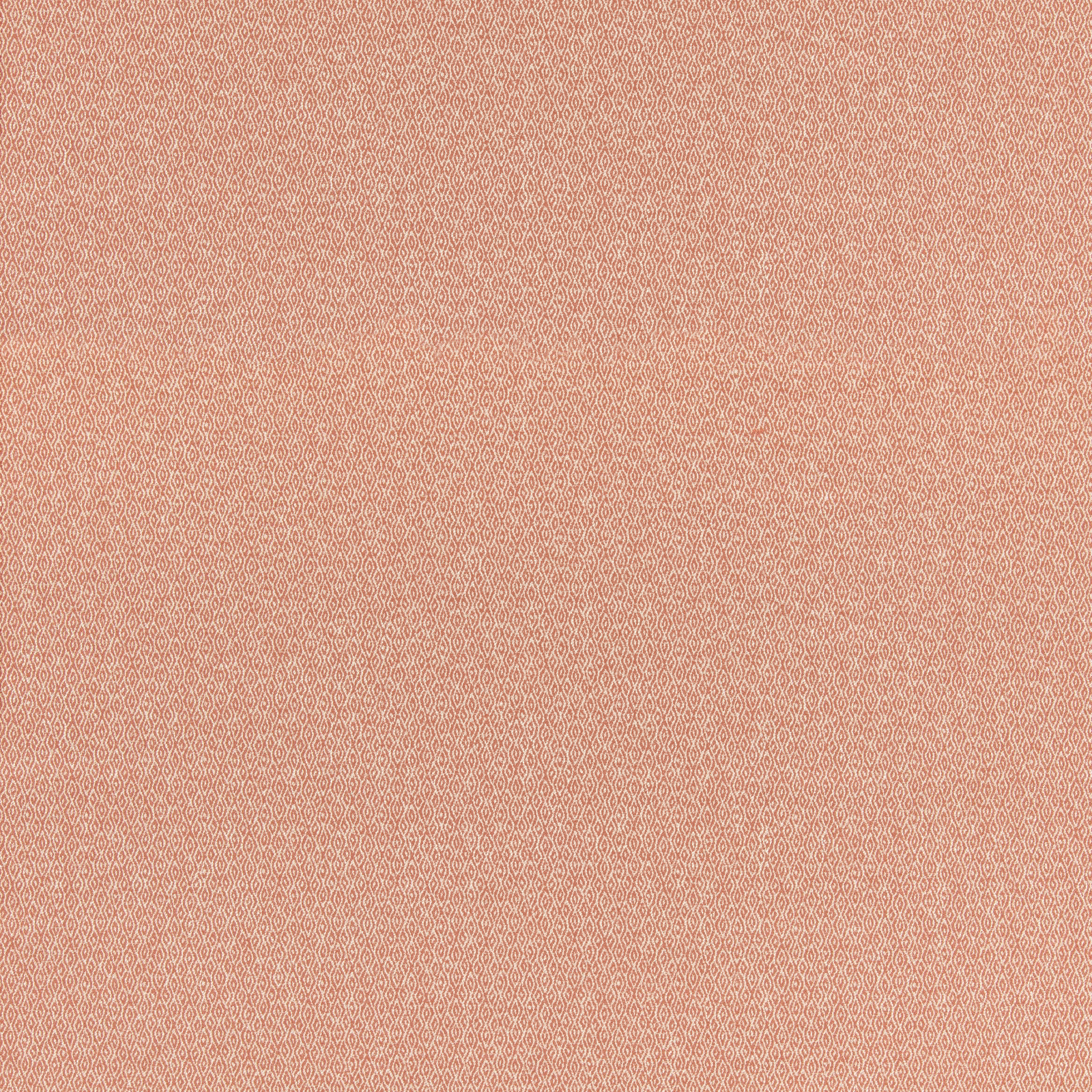 Close-up of muted coral-pink fabric with a fine, softly mottled woven texture