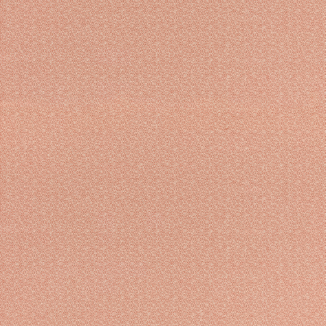 Close-up of muted coral-pink fabric with a fine, softly mottled woven texture