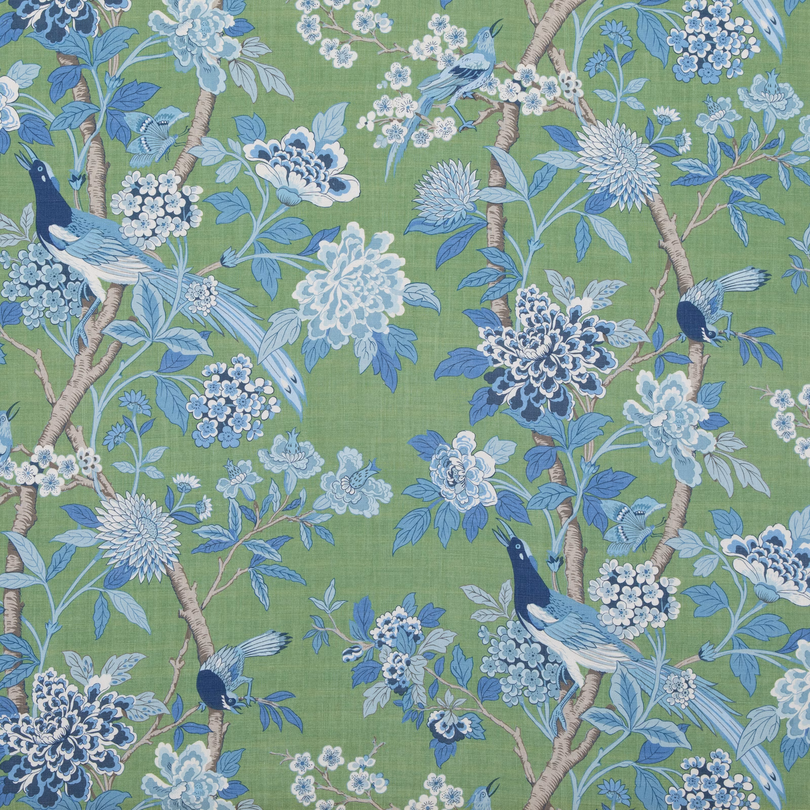 Emerald green linen with blue birds, flowering branches and pale hydrangea clusters