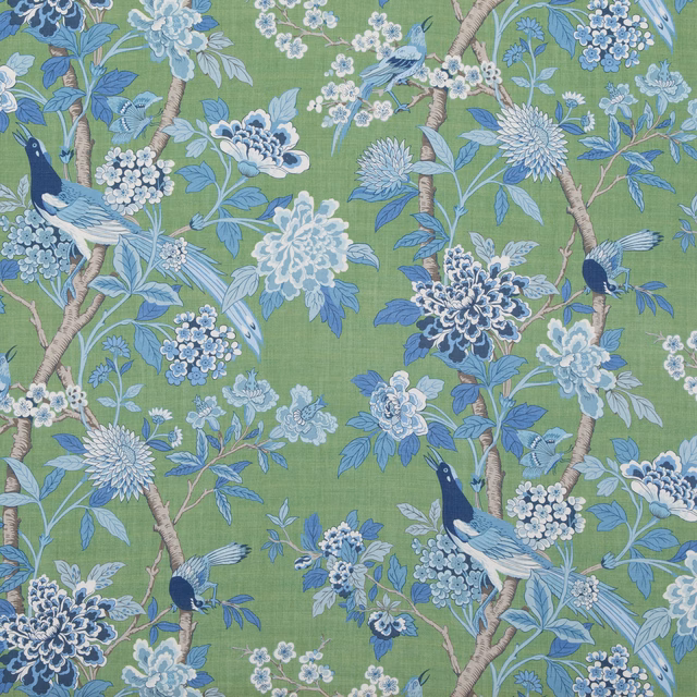 Emerald green linen with blue birds, flowering branches and pale hydrangea clusters