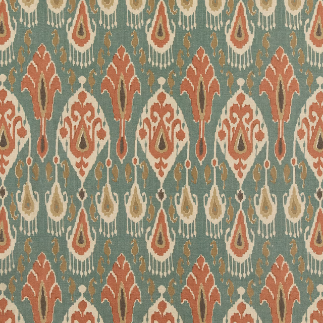 Muted teal ikat fabric with rust, cream and olive geometric motifs