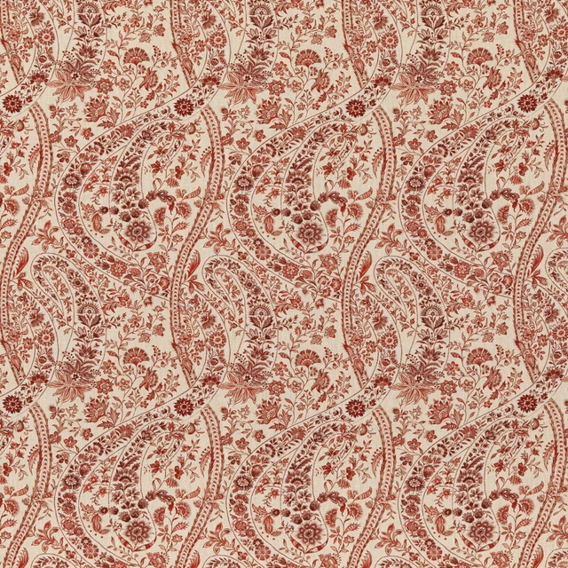 Rust-red paisley vines and floral sprays repeat across a warm cream linen ground