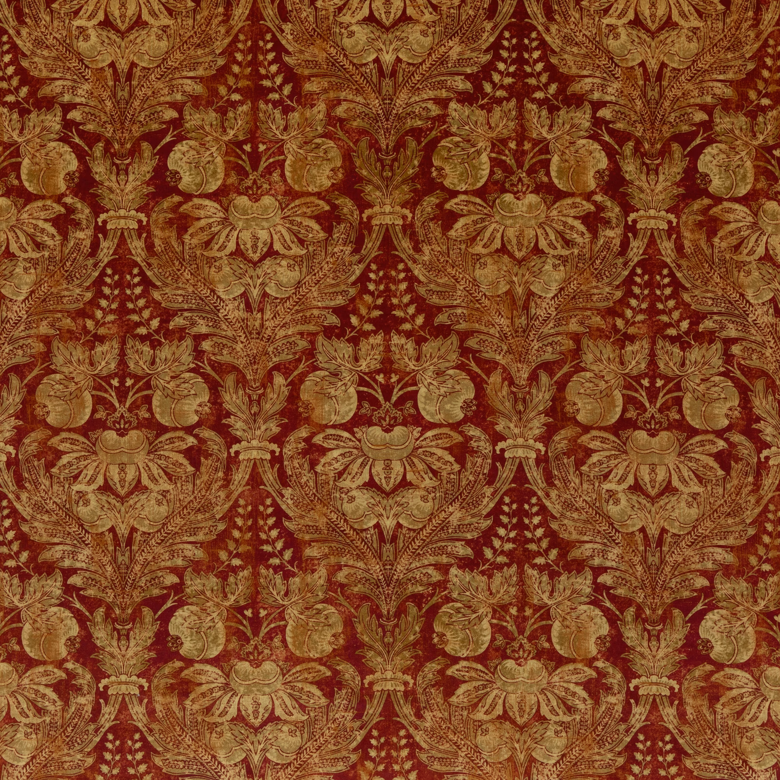 Deep Indian red velvet with ornate antique-gold floral damask and scrolling foliage