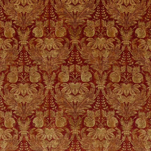 Deep Indian red velvet with ornate antique-gold floral damask and scrolling foliage