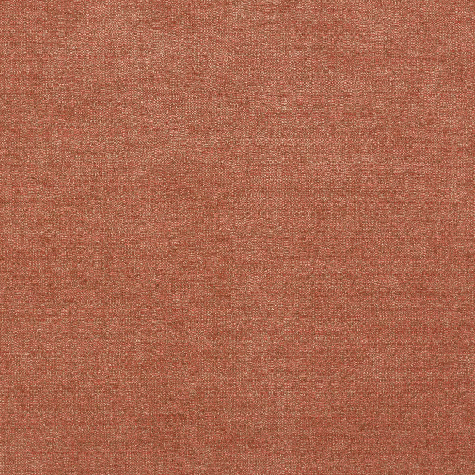 Close view of muted brick terracotta fabric with a fine crosswoven texture