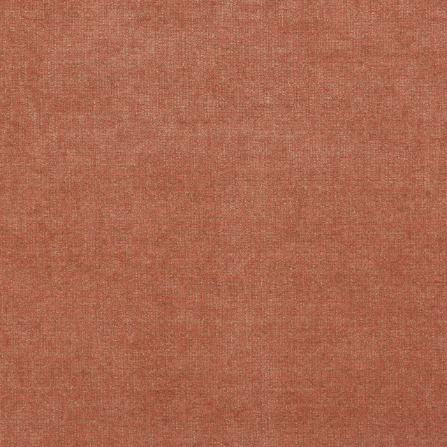 Close view of muted brick terracotta fabric with a fine crosswoven texture