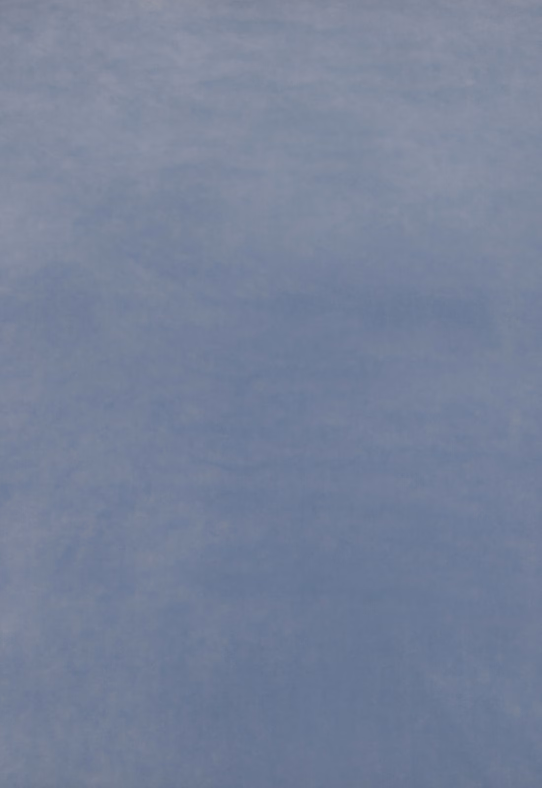Muted blue-grey velvet swatch showing soft directional nap and subtle tonal variation