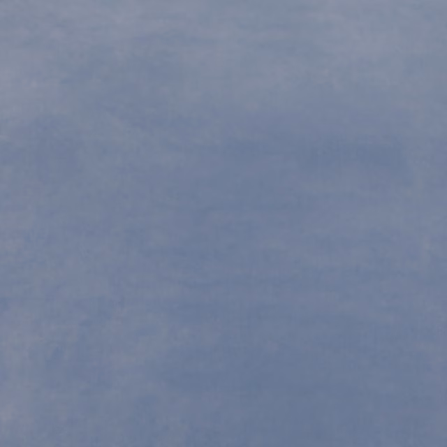 Muted blue-grey velvet swatch showing soft directional nap and subtle tonal variation