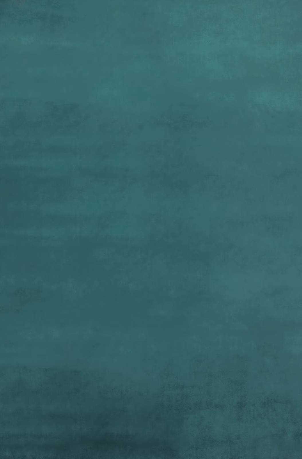 Close-up of jade teal velvet with softly shifting nap and cloudy tonal depth