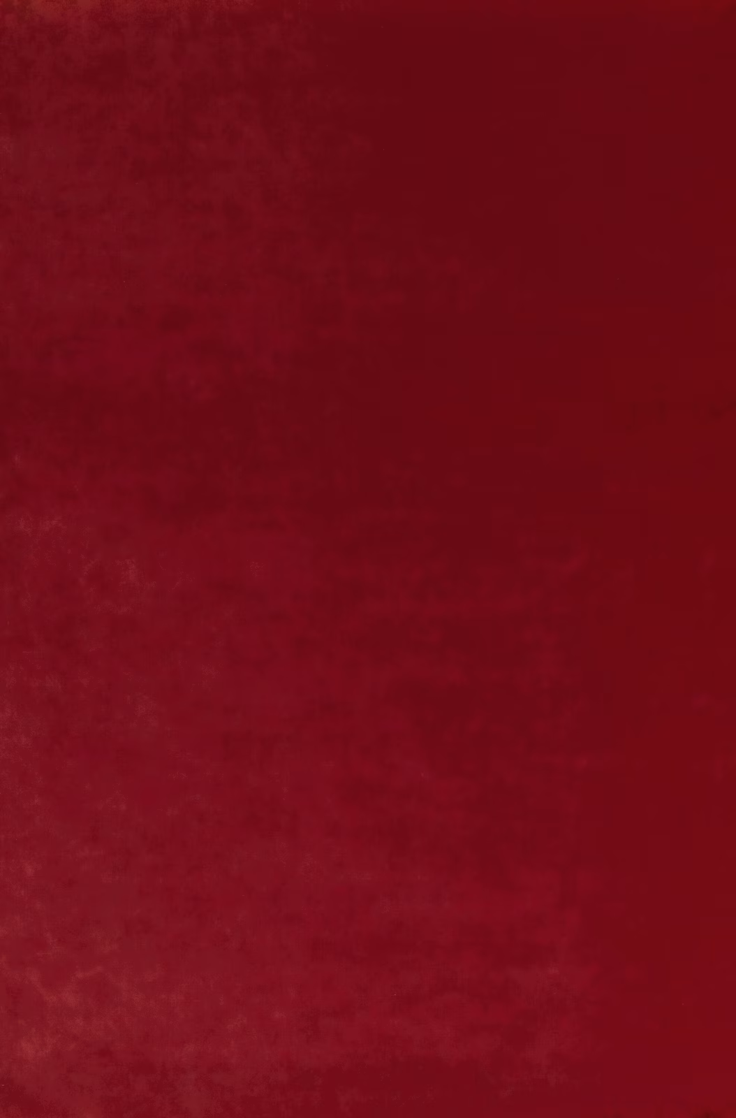 Deep ruby red velvet with subtle directional pile and soft light variation