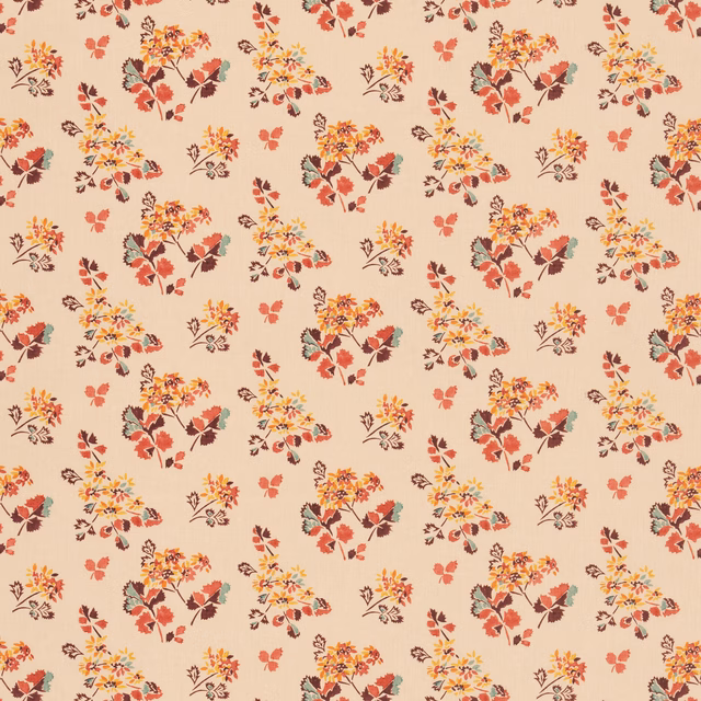 Warm blush ground with scattered coral, ochre and blue floral clusters