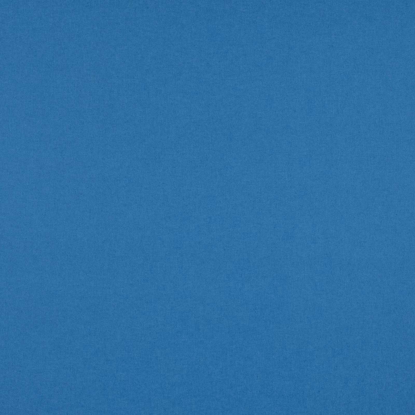 Close-up of finely textured, muted mid-blue woven fabric with a soft cloudy surface
