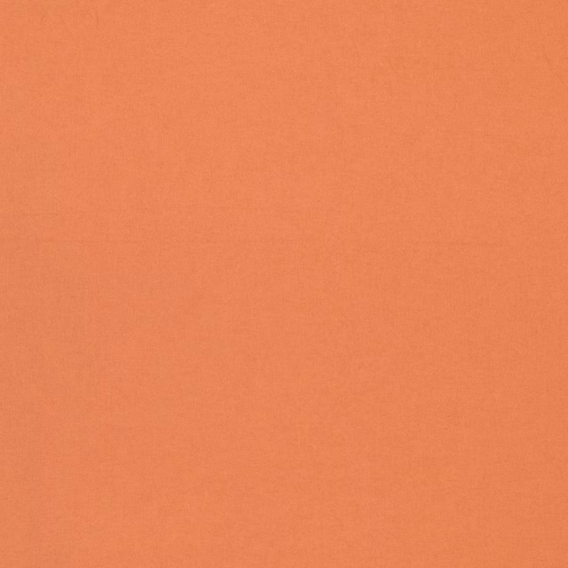 Warm terracotta plain-weave fabric with a softly textured coral surface