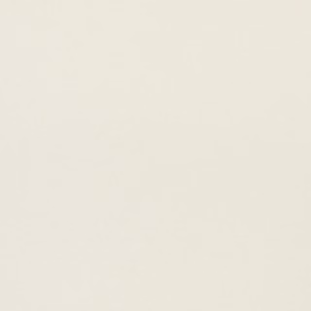 Close-up of softly slubbed ivory linen-blend fabric with an even pale weave