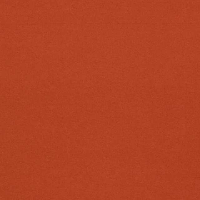 Warm spice-red plain woven fabric with a softly textured surface