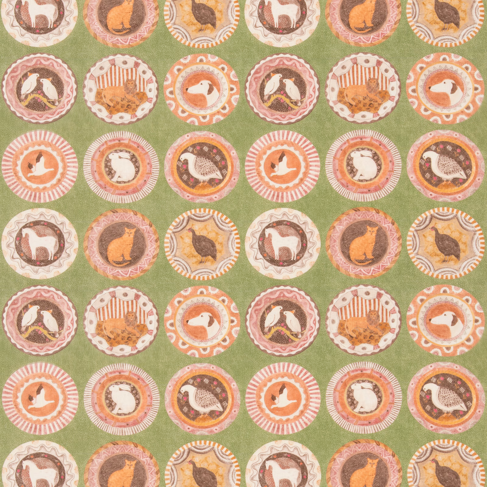 Moss green fabric with coral animal medallions and cream scalloped circular borders