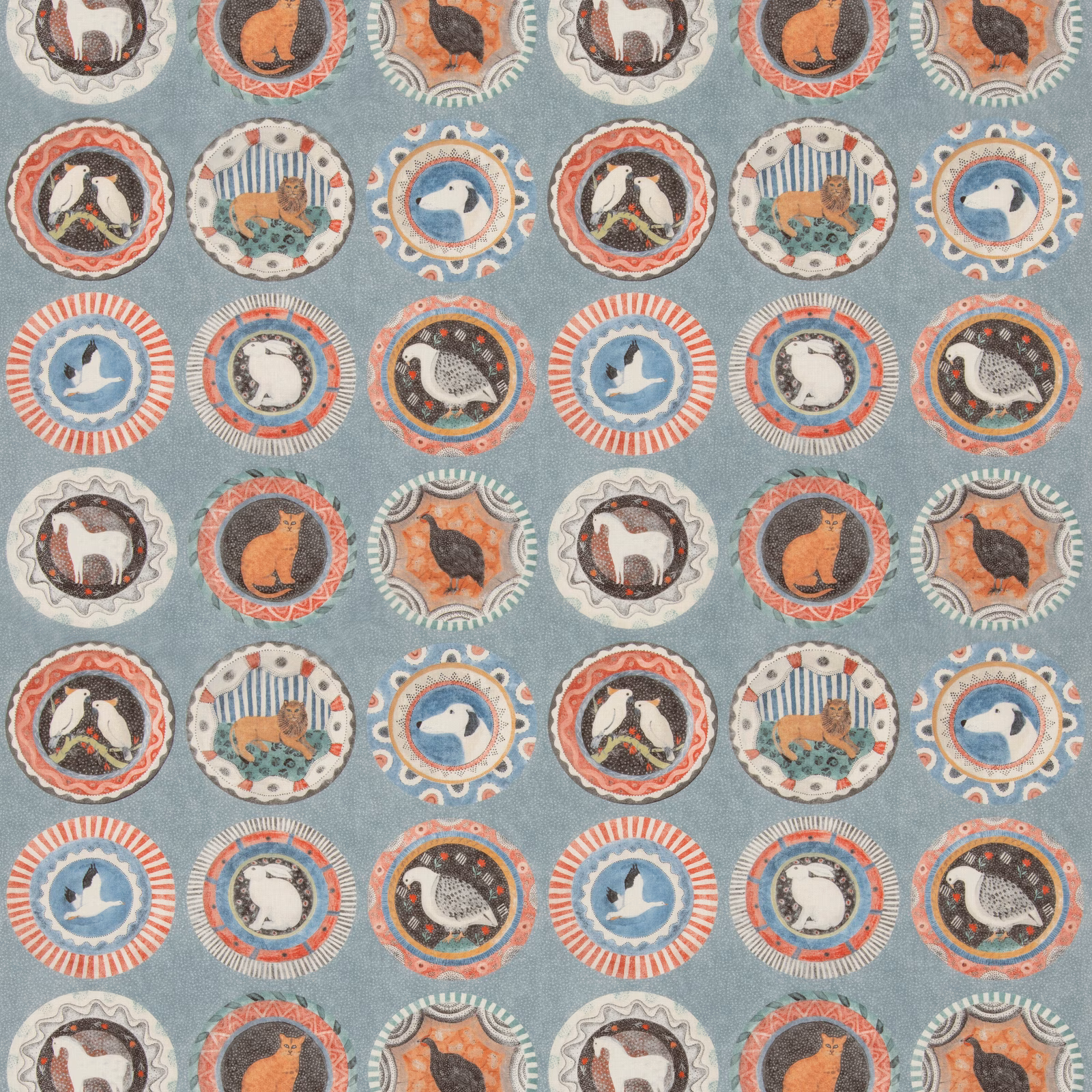 Dusty teal fabric with illustrated animal medallions in coral, cream and rust