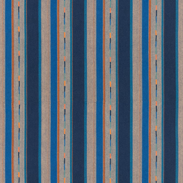 Indigo and blue-grey striped fabric with chevrons and tiny orange woven accents