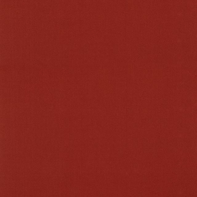 Close-up of deep garnet red fabric with subtle, tactile woven texture