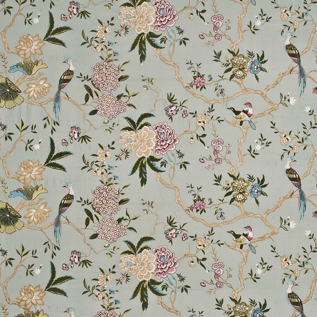 Muted aqua fabric with embroidered birds, flowering branches and multicoloured blossoms