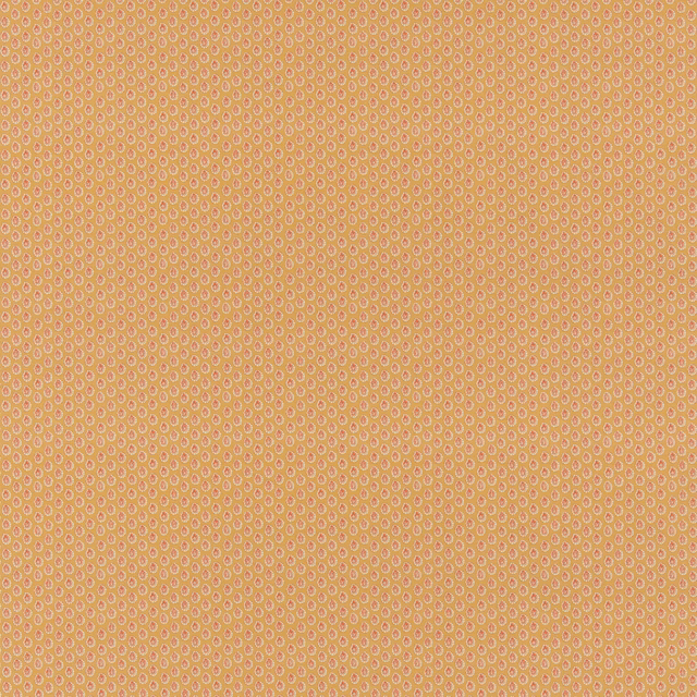 Warm ochre cotton fabric with tiny pale looping dots in a dense geometric repeat
