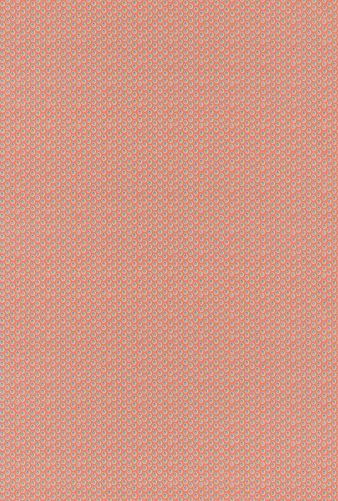 Coral red cotton with tiny blue-grey oval dot motifs in a dense repeat
