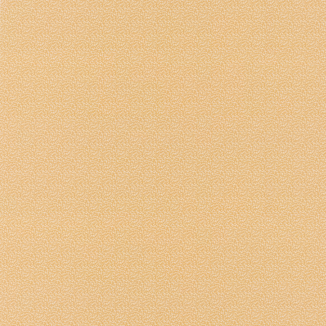 Close-up of warm ochre cotton with a fine softly granular surface
